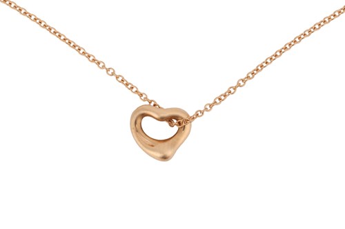 Lot 64 - Tiffany & Co. - an 18ct yellow gold open heart...