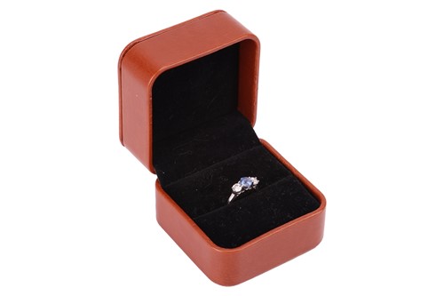 Lot 169 - A sapphire and diamond three-stone ring,...
