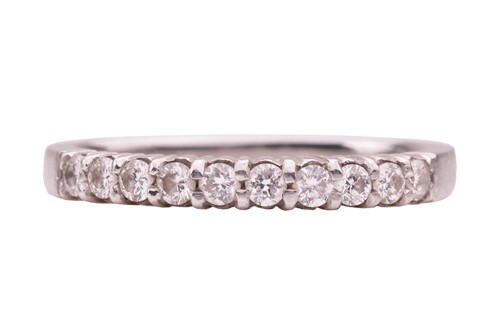 Lot 75 - A diamond-set half eternity ring in platinum,...