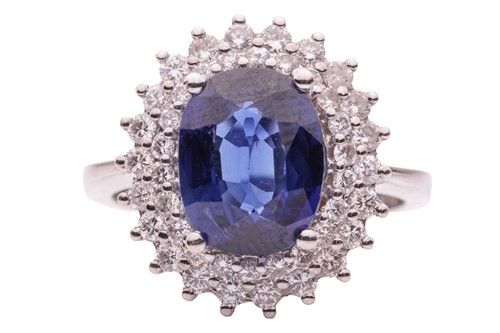 Lot 36 - A synthetic sapphire and diamond cluster ring,...