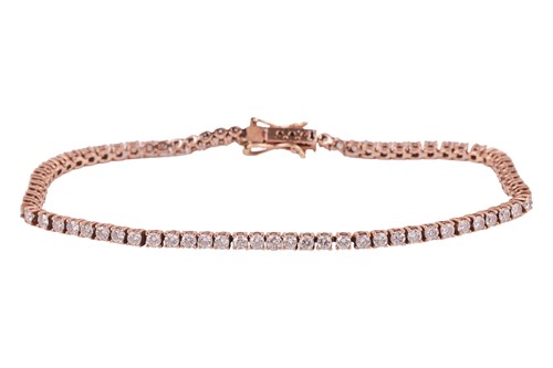 Lot 240 - A diamond line bracelet, comprising...