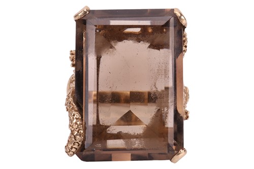 Lot 98 - A large smokey quartz cocktail ring in 9ct...