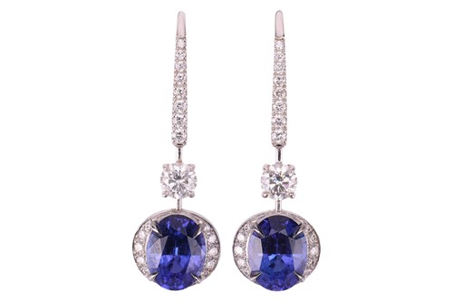 Lot 50 - A pair of tanzanite and diamond pendant...