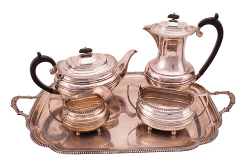 Lot 348 - A four-piece silver tea set with a silver tray,...