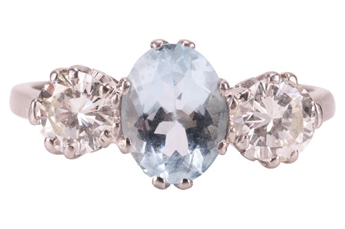 Lot 210 - An aquamarine and diamond trilogy ring,...