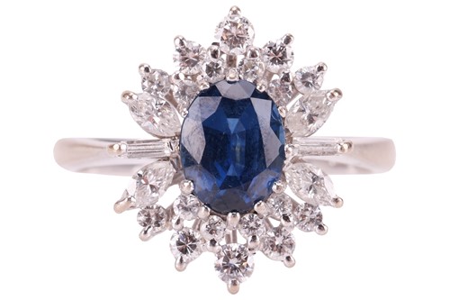 Lot 6 - A sapphire and diamond cluster ring, centred...