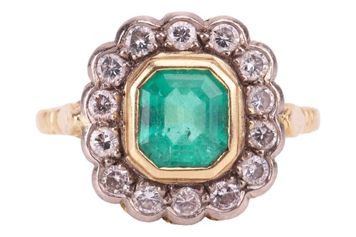 Lot 208 - An emerald and diamond cluster ring, centred...