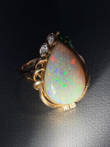 Lot 64 - An opal dress ring, collet-set with a...