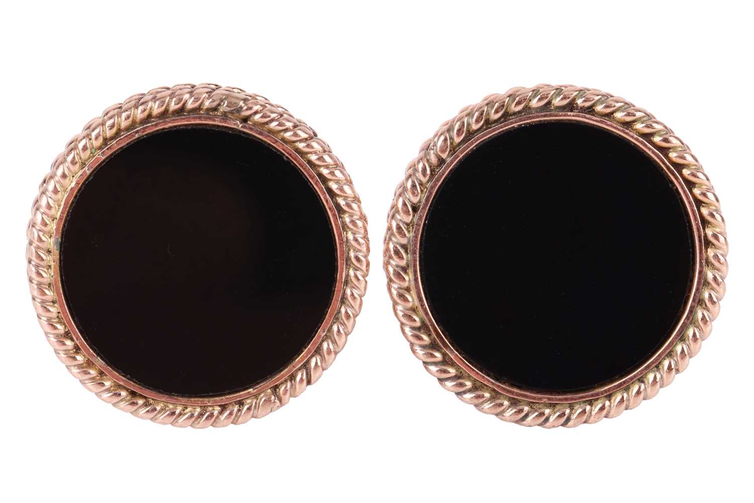 Lot 33 - A pair of onyx-set cufflinks, each containing...