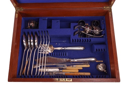 Lot 83 - Two silver-plated canteens in brass-bound oak...