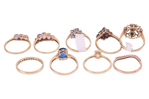 Lot 151 - A collection of nine gem-set rings in 9ct gold;...