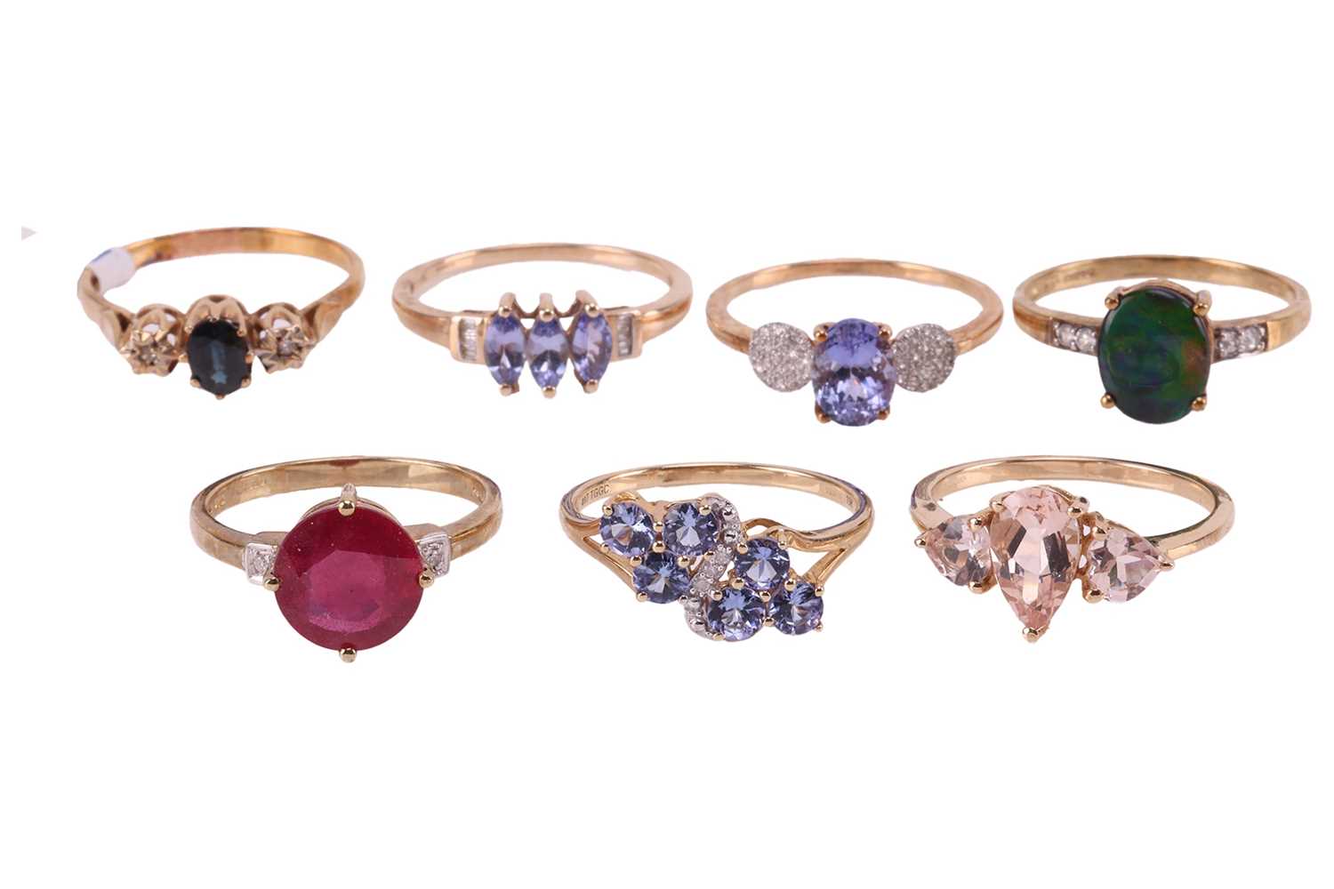 Lot 24 - A collection of seven gem-set rings in 9ct...