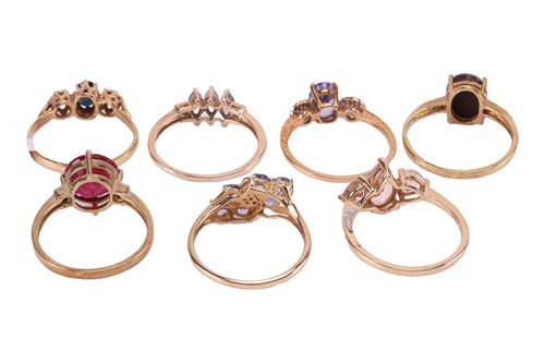 Lot 24 - A collection of seven gem-set rings in 9ct...