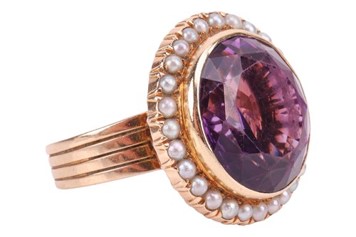 Lot 31 - A large amethyst and seed pearl cocktail ring,...