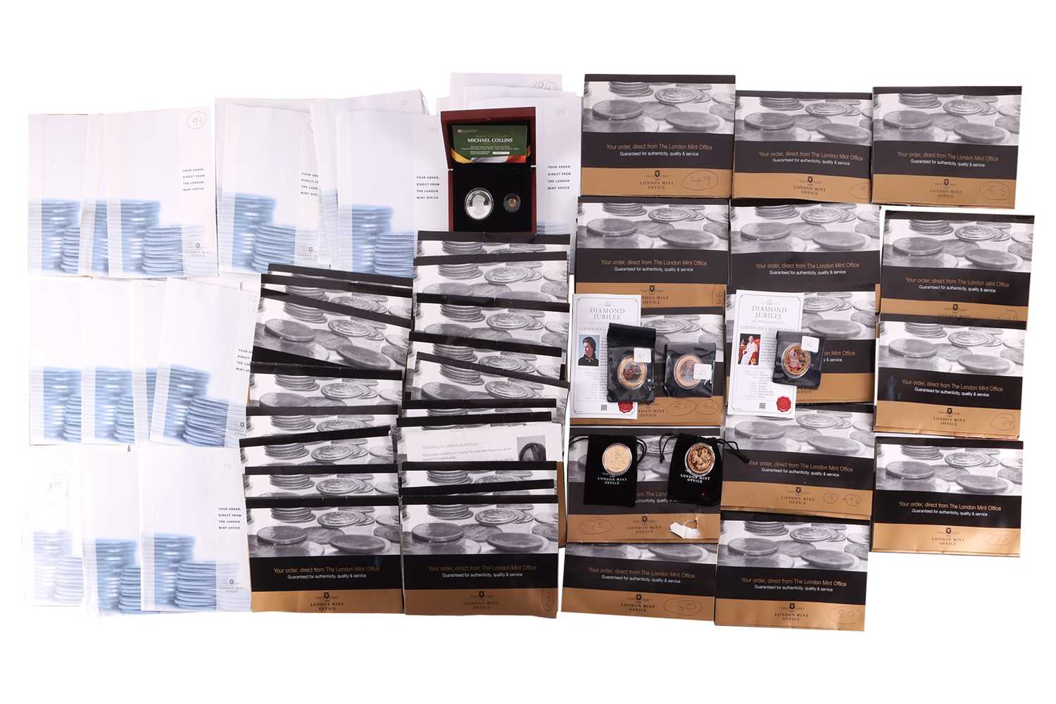 Lot 102 - A large group of commemorative coin sets, to...