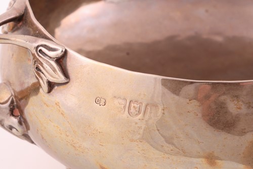 Lot 92 - An Arts and Crafts silver three-handled bowl,...