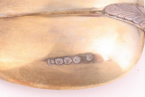 Lot 108 - A cased set of silver gilt spoons and sugar...