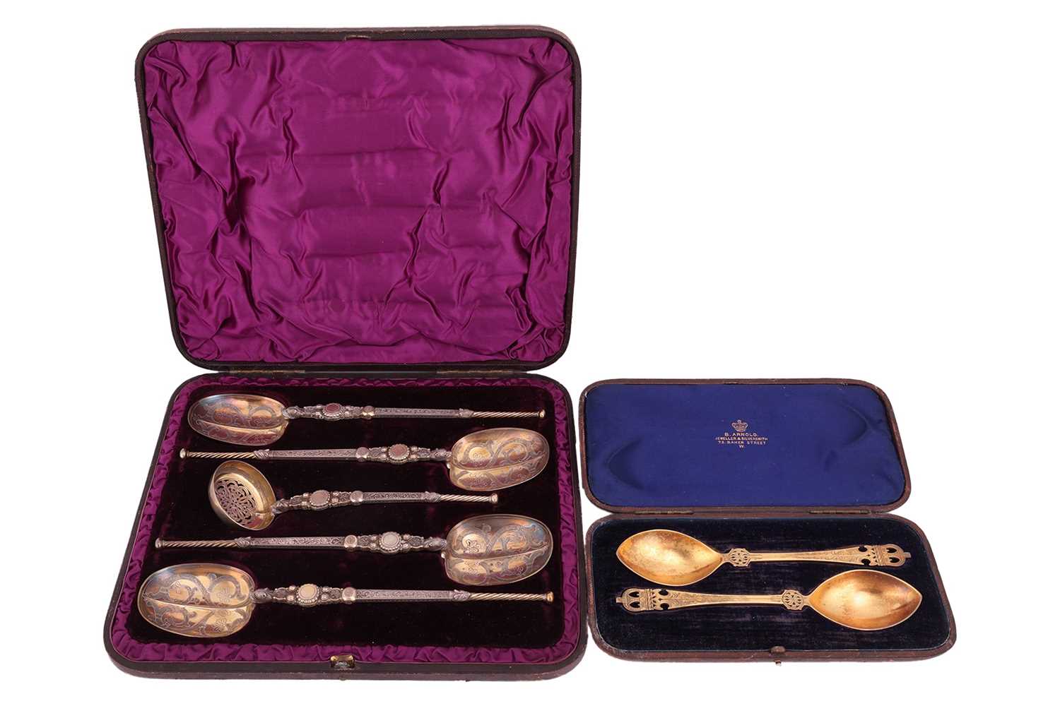 Lot 108 - A cased set of silver gilt spoons and sugar...