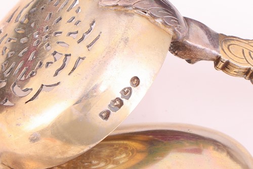 Lot 108 - A cased set of silver gilt spoons and sugar...