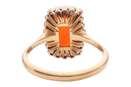 Lot 4 - A fire opal and diamond halo ring in 18ct gold,...