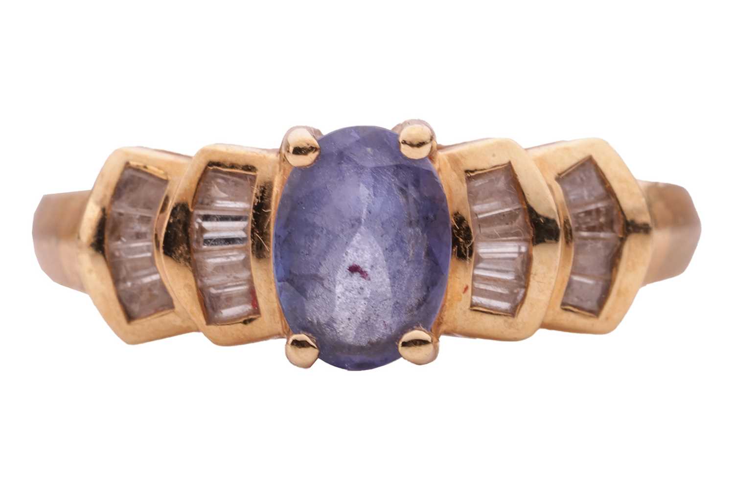 Lot 16 - A tanzanite and diamond-set ring in 18ct gold,...