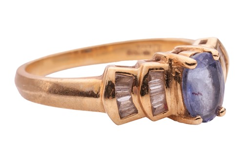 Lot 16 - A tanzanite and diamond-set ring in 18ct gold,...