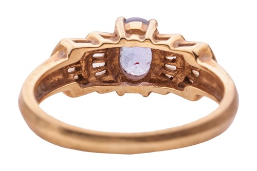 Lot 16 - A tanzanite and diamond-set ring in 18ct gold,...