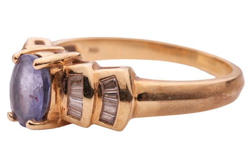 Lot 16 - A tanzanite and diamond-set ring in 18ct gold,...
