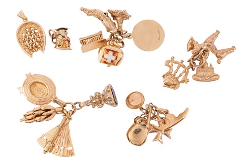 Lot 15 - A collection of charms and pendants, including...