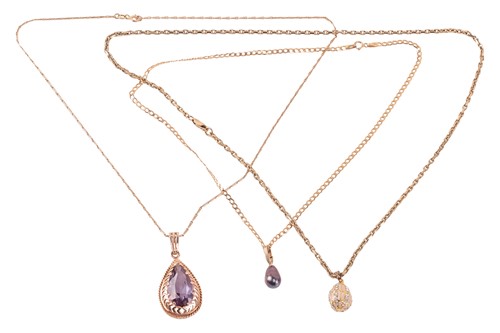 Lot 67 - Three pendant on chains; including a synthetic...