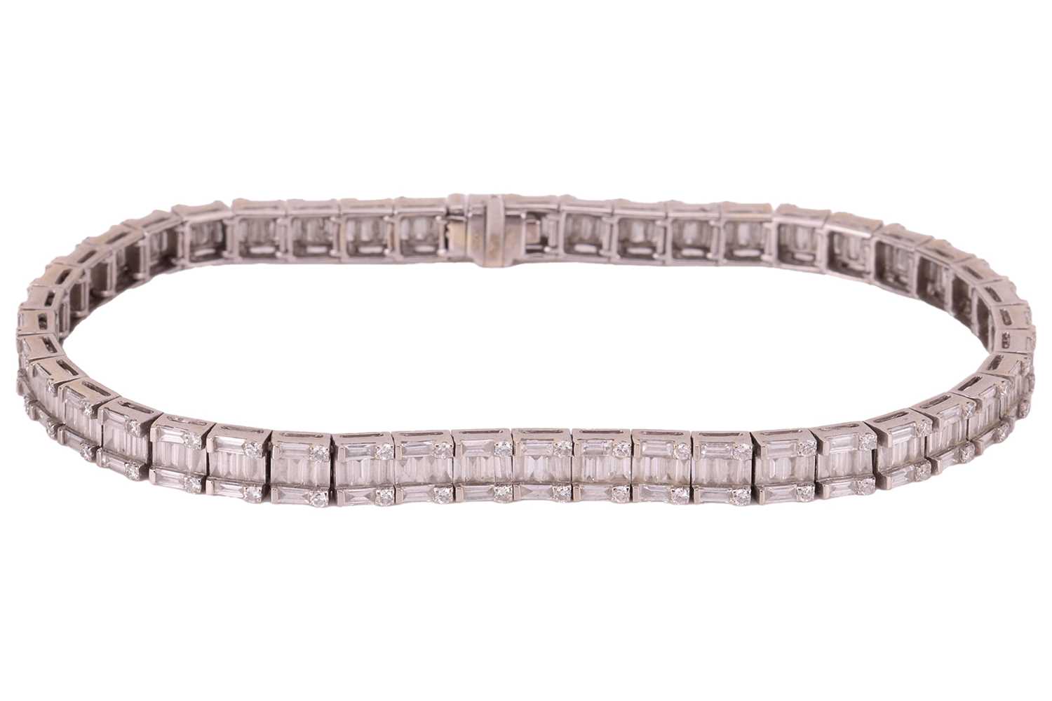 Lot 49 - A diamond line bracelet; comprising forty-five...