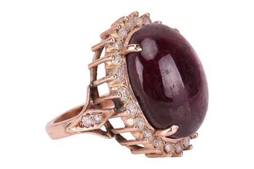 Lot 34 - A star sapphire and diamond dress ring,...