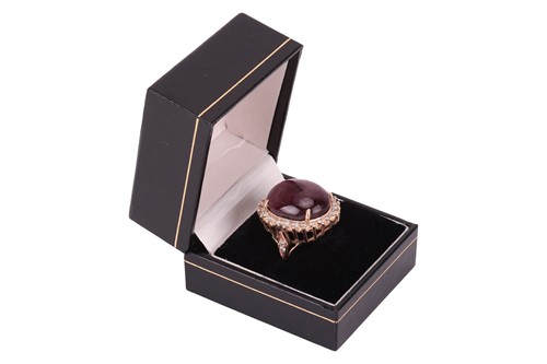 Lot 34 - A star sapphire and diamond dress ring,...