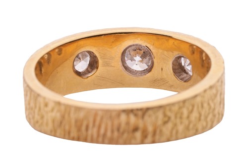 Lot 28 - A diamond three stone ring in 18ct, comprised...