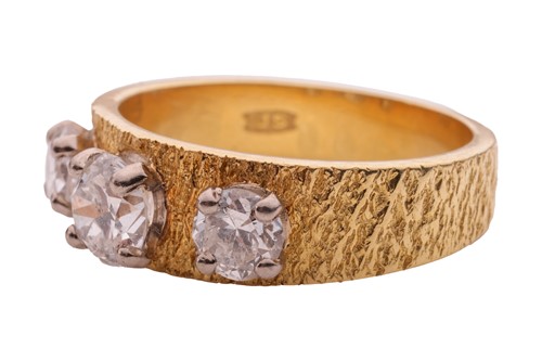 Lot 28 - A diamond three stone ring in 18ct, comprised...