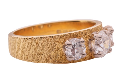Lot 28 - A diamond three stone ring in 18ct, comprised...