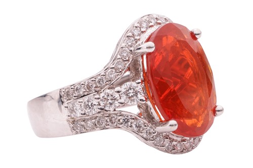 Lot 36 - A fire opal and diamond-set cluster ring, the...
