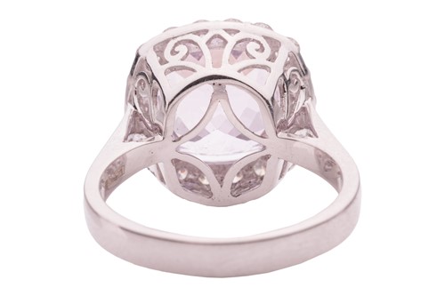 Lot 50 - A kunzite and diamond halo ring in 18ct white...