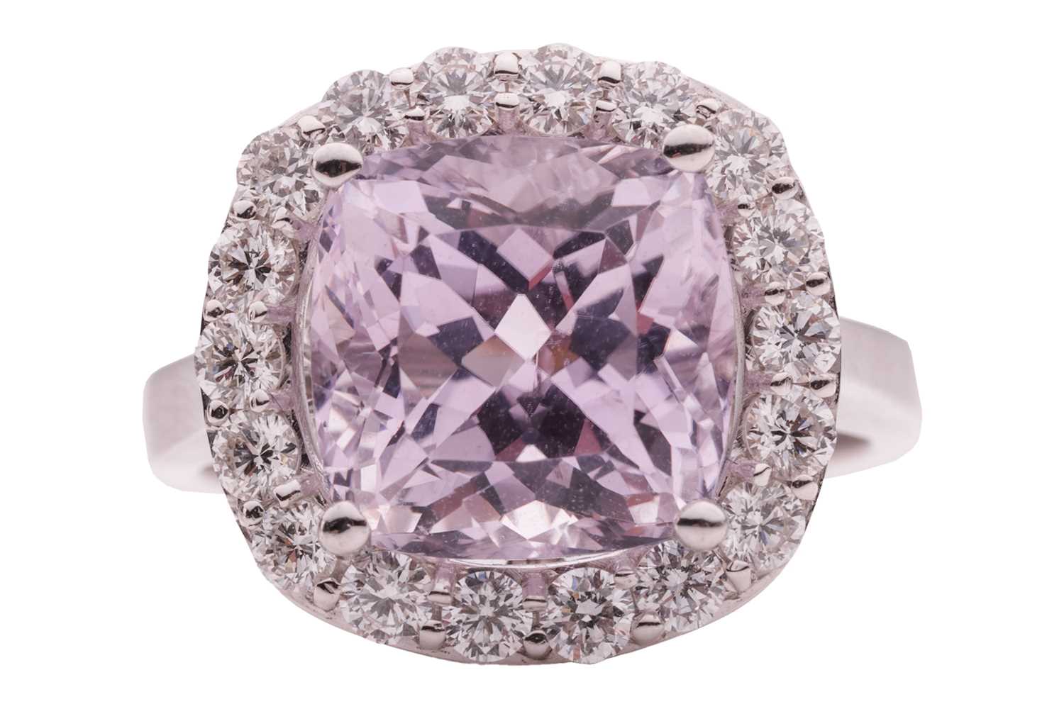 Lot 50 - A kunzite and diamond halo ring in 18ct white...