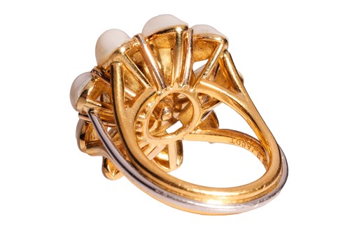Lot 101 - A star sapphire and pearl dress ring in 18ct...