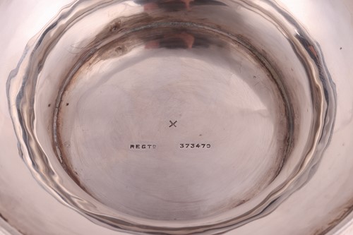 Lot 358 - An Arts and Crafts silver bowl by Wakely &...