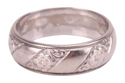 Lot 35 - An 18ct white gold wedding band, the 5.7mm...
