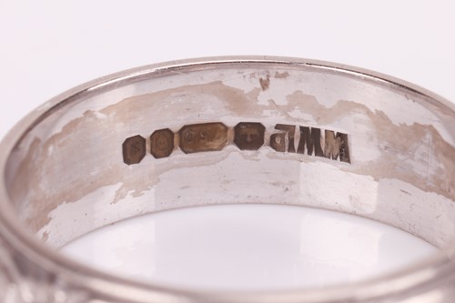 Lot 35 - An 18ct white gold wedding band, the 5.7mm...