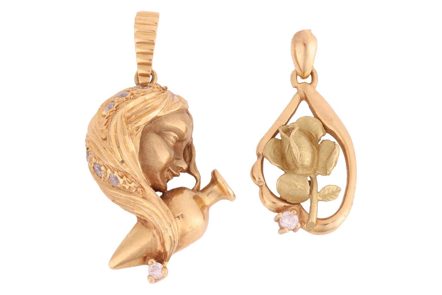Lot 56 - Two pendant charms; the first depicting...