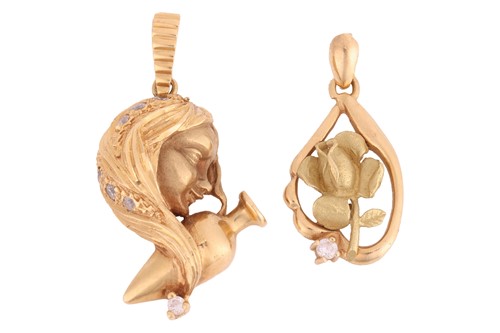 Lot 56 - Two pendant charms; the first depicting...