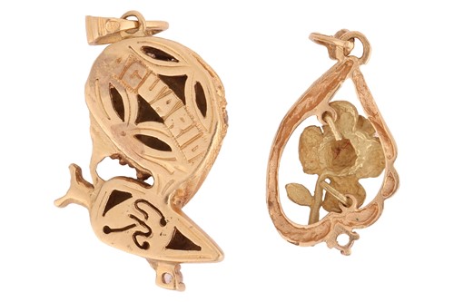 Lot 56 - Two pendant charms; the first depicting...
