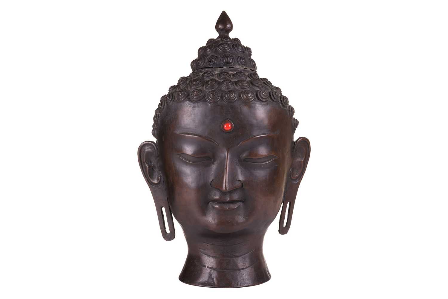 Lot 49 - A patinated bronze head of the Buddha , with...