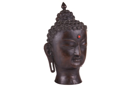 Lot 49 - A patinated bronze head of the Buddha , with...