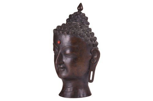 Lot 49 - A patinated bronze head of the Buddha , with...