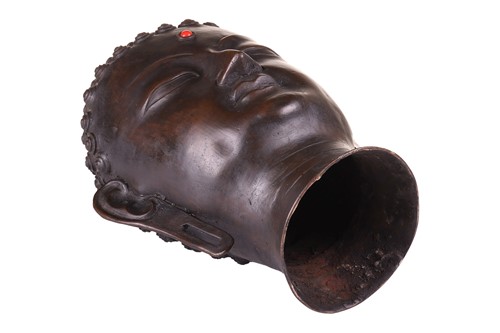 Lot 49 - A patinated bronze head of the Buddha , with...